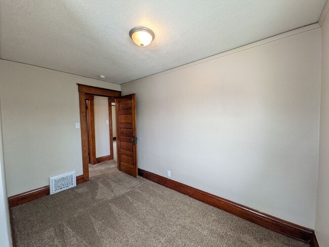 Building Photo - Large 4 Bedroom Home with Garage, Deck, & Fence!