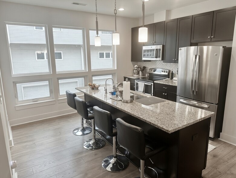 Modern kitchen with loads of natural light. - 1247 W 75th St