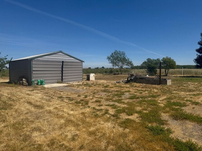 Building Photo - 4 Bed / 2 Bath Country Home – Solar + Move-In Ready