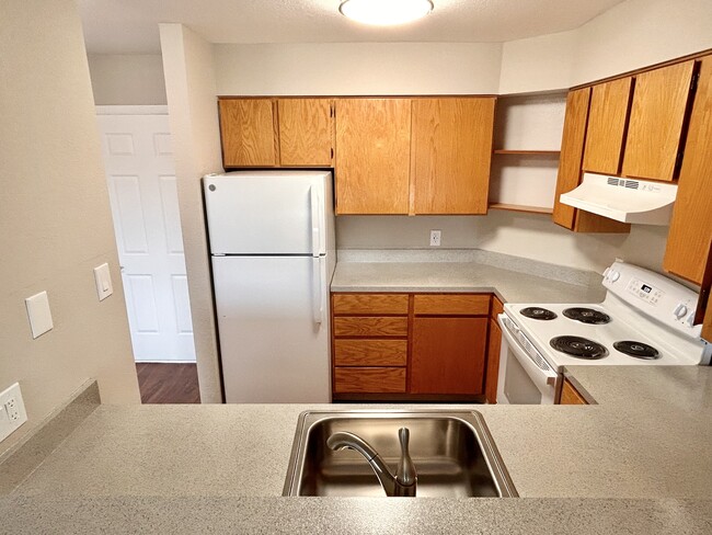 Experience culinary delights in this inviting kitchen space, designed for modern living. - One Park View