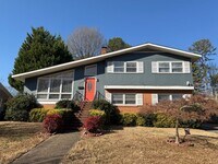 Building Photo - Freshly Painted Split-Level Home with Large Deck & Lawn Care Included