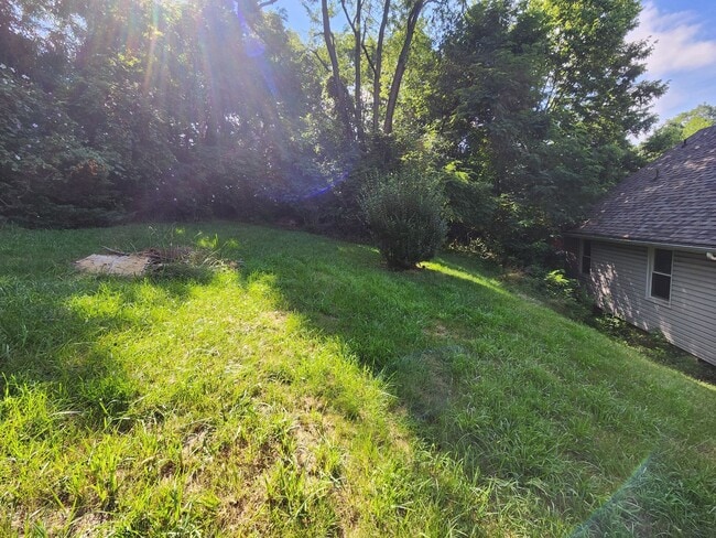 Building Photo - 4 BR home with first-floor living, new roof, and a private-feeling backyard in Lincoln Place