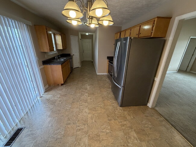 Building Photo - $1,925/mo | Lawn care included | No monthly pet rent. Move-in ready 3BR/2BA corner-lot home in La...