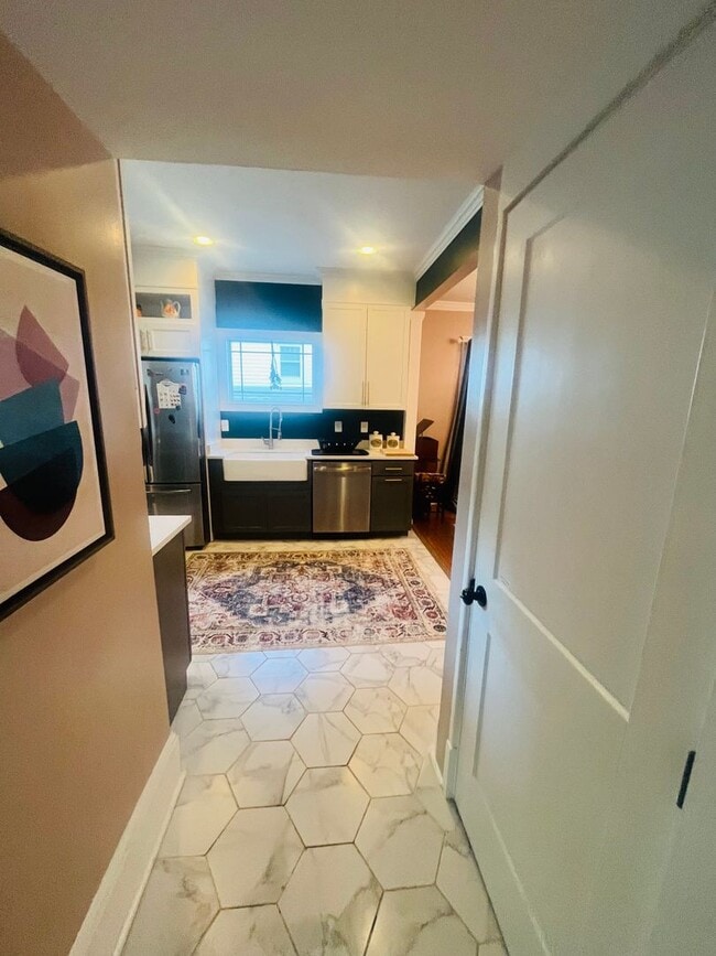 Building Photo - The West Jefferson — Furnished comfort in ...