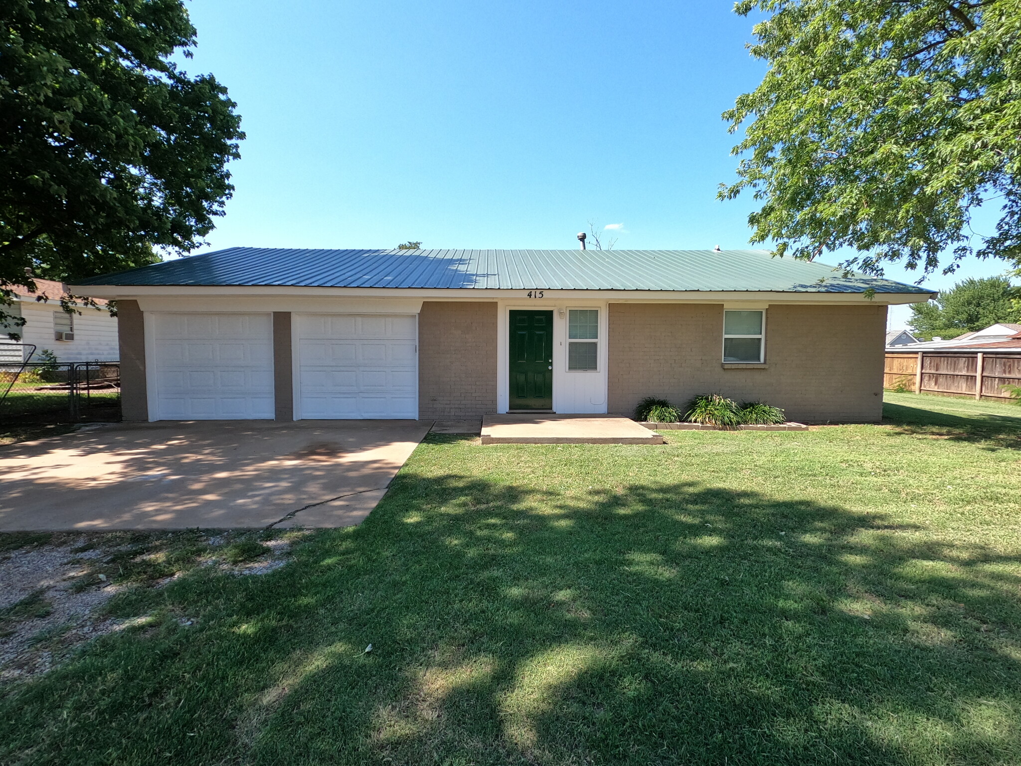 Front of house with two car garage - fresh coat of paint on all surfaces. - 415 W Guthrie St