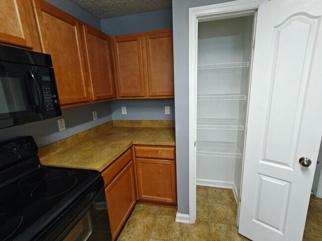 Building Photo - Spacious 2-Bed, 2.5-Bath Townhome with Gar...