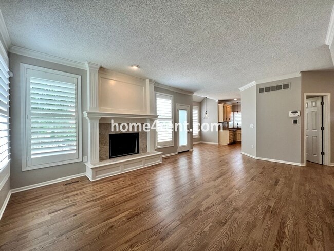 Building Photo - Updated Kitchen, Large Two Tiered Deck, Finished Basement in Blue Valley Schools!