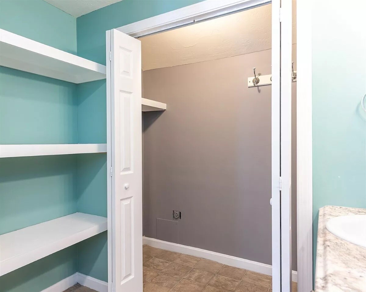 Washer and dryer hookups in the main bathroom closet. - 554 Lake Ave