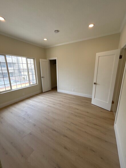 Master bedroom with walk in closet and additional storage space - 1062 S Shenandoah St