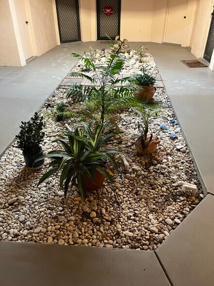 Attractive atrium leading to unit - 1985 NE Collins Cir