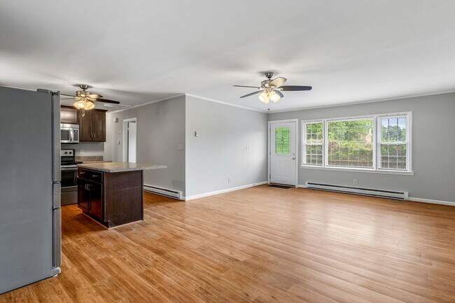Building Photo - Updated Home, Stainless Steel Appliances, Wood Like Flooring, Deck, Garage!