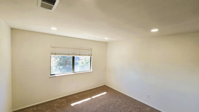 Building Photo - "Spacious, Sunlit Home in a Peaceful Ranch...