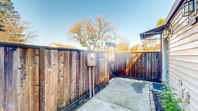 Building Photo - Cozy 1 bedroom 1 bath end unit condo with 1 car garage and private patio located next to Peterson...