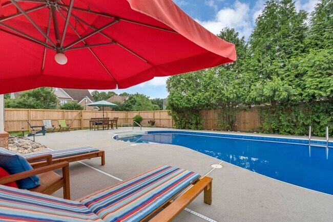 Building Photo - Beautiful brick home with a saltwater pool