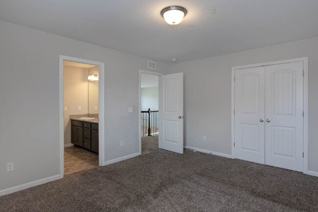 Building Photo - 4BR/3.5BA · 2,809 SF · Owner's Suite on Main · Fenced Yard · Midland, GA — $2,800/mo