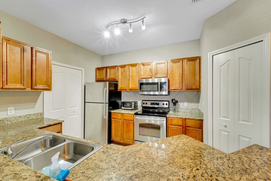 Kitchen with stainless steel appliances - 8351 38th Street Cir E