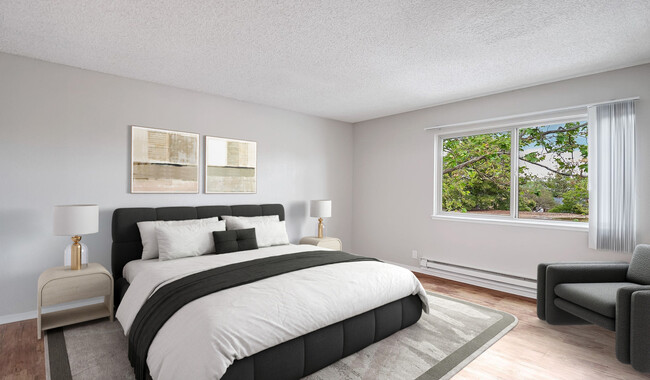 Bedroom includes walk-in closet, while overlooking the balcony - Laurel Crossing Apartment Homes