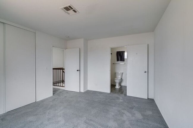 Building Photo - Double Primary Townhome with Spacious Backyard in 89115!