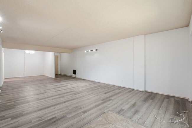 Building Photo - This expansive ground level residence is set within a serene, gated garden community surrounded b...