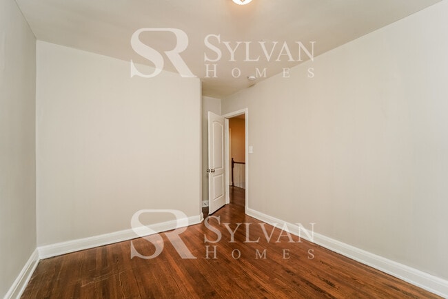 Building Photo - Welcome to this charming abode.