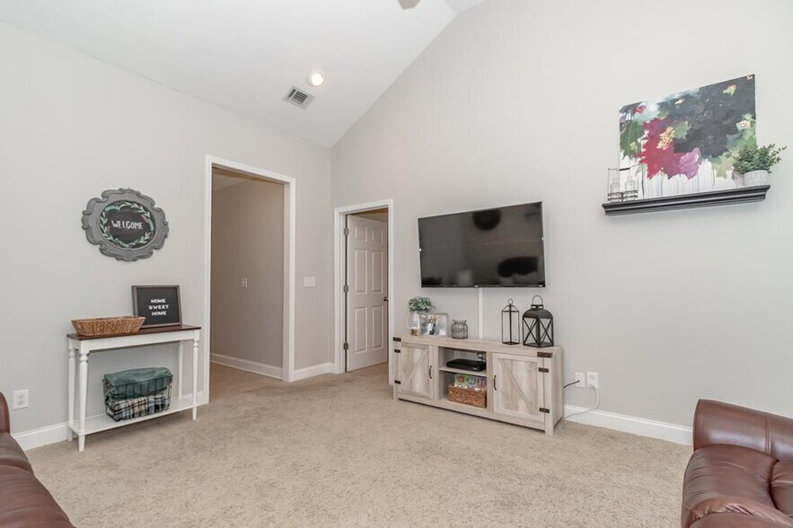 Living room, left door to hallway to kitchen, right door to master bedroom - 434 Bowen Fls