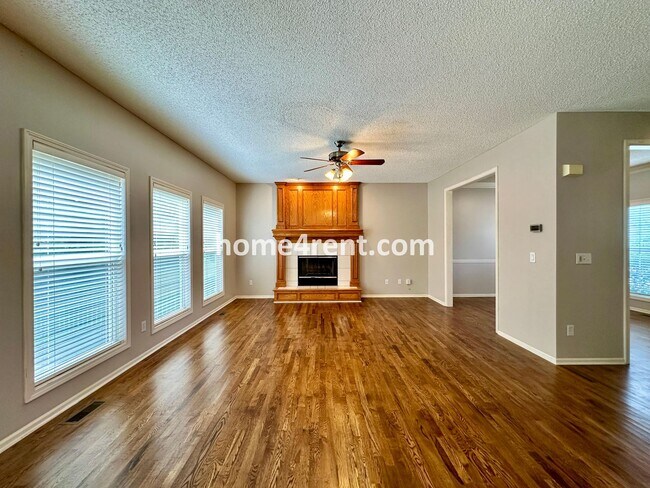 Building Photo - Beautiful Four-Bedroom Home with Three Car Garage, Wood Floors, Finished Basement and a Fenced Ya...
