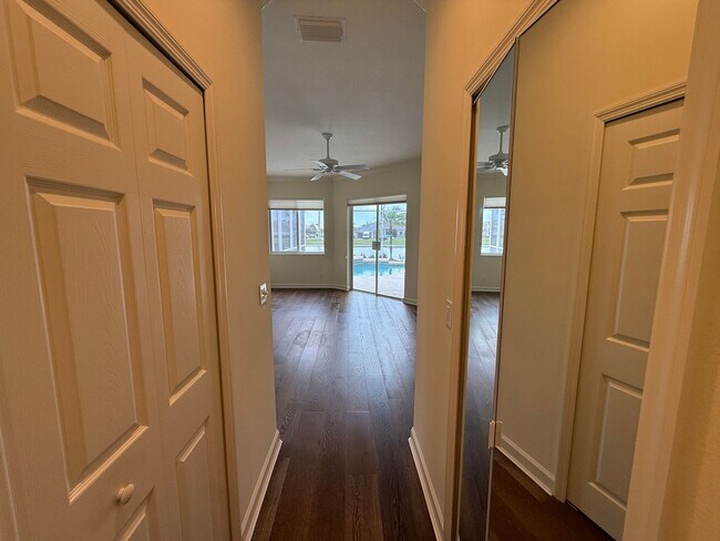 Building Photo - Luxurious 4 Bedroom 3 Bath Lakefront Pool Home W/3-Car Garage