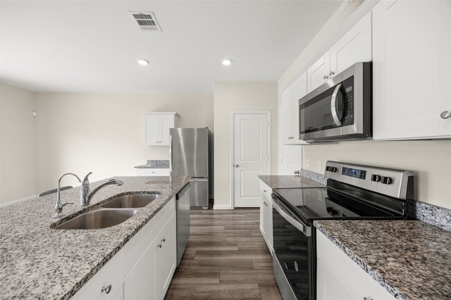 Building Photo - 7810 Pink Dahlia Dr