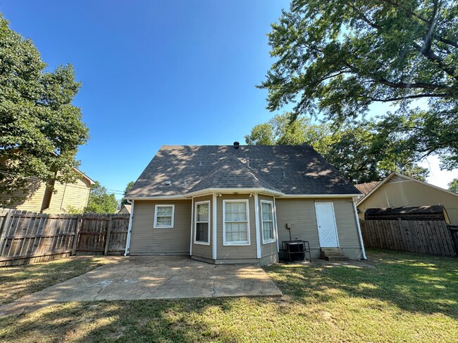 Building Photo - Charming 3BR/2BA Near Southwind | Hardwood Floors, Brick Fireplace, Bay Window & 2-Car Garage
