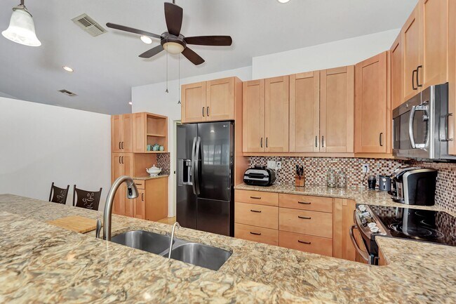 Building Photo - BEAUTIFUL 2 BEDROOM 2 BATHROOM + A DEN VILLA WITH GORGEOUS LAKE VIEWS!