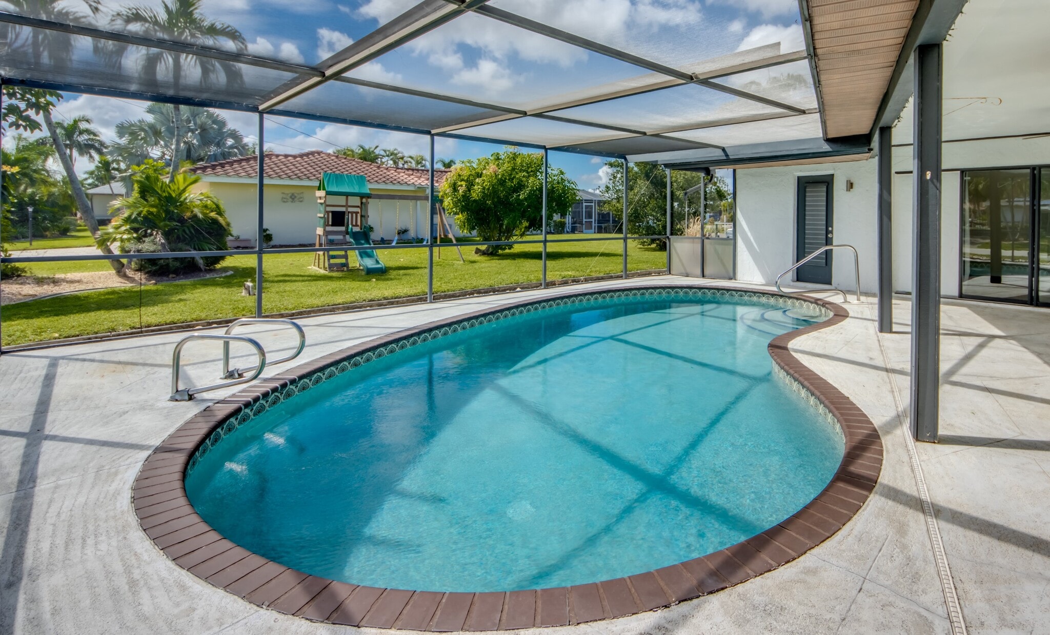 Play with the family on the new swing set and then jump in the pool. - 2316 Everest Pky