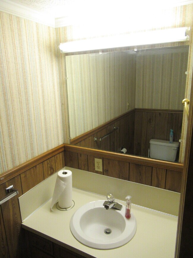 Building Photo - Charming All-Brick Ranch with Finished Bas...