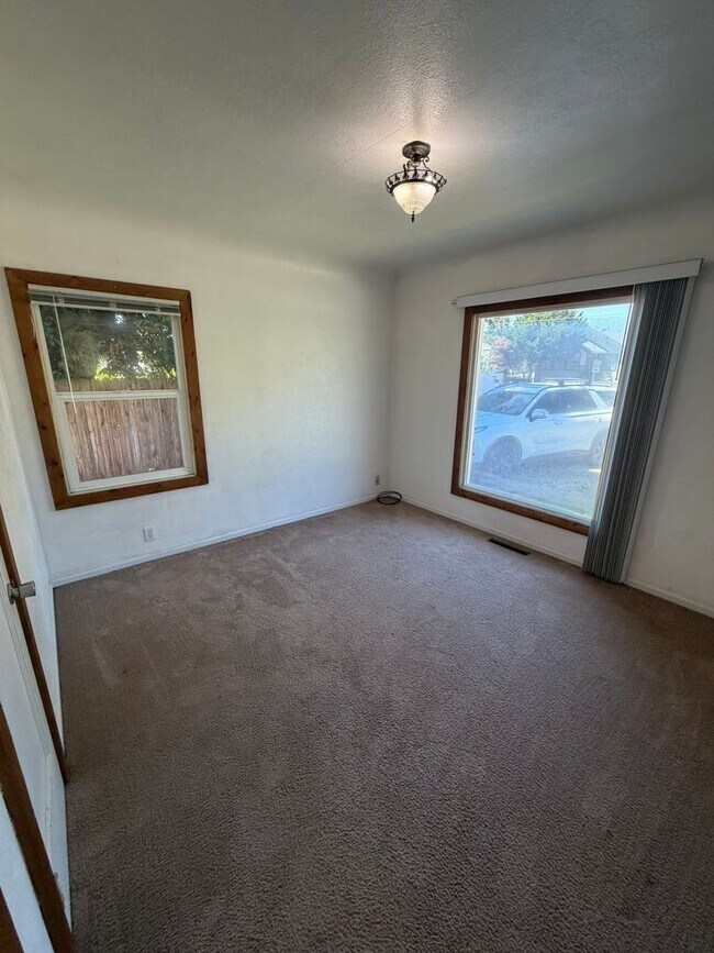 Building Photo - 2 Bedroom with a garage with Large fenced yard!