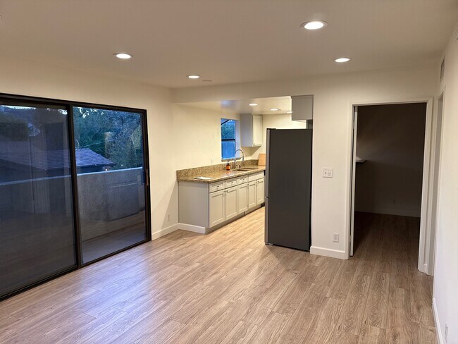 Living room overlooking kitchen - 10330 Riverside Dr