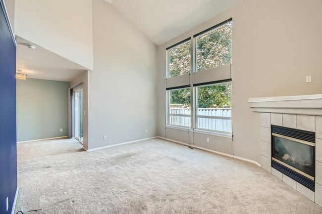 Floor to ceiling windows in living room - 1437 NE Birkshire Ct