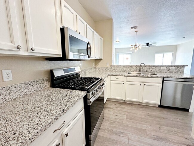 Building Photo - 3 BEDROOM TOWNHOME WITH YARD + 2 CAR GARAG...