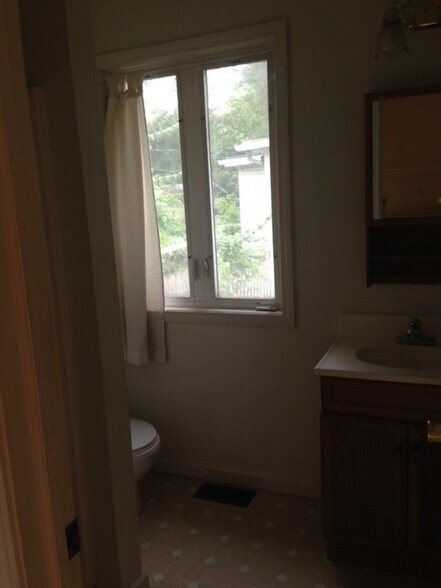 Second Bathroom with stand up shower, door off of the laundry room. - 212 E Vermilya Ave