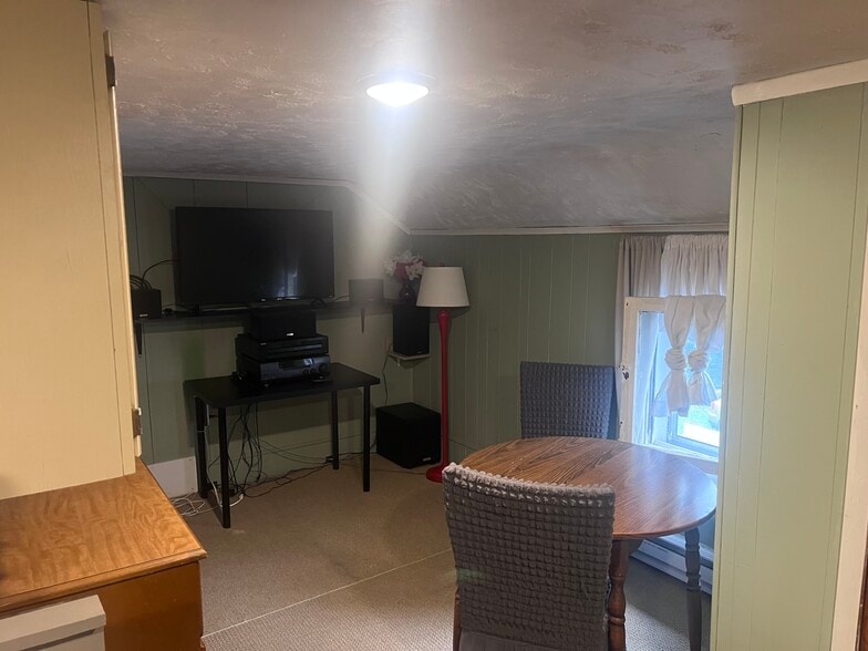 Rec/dining area with large tv and stereo - 668 Brooklyn Ave