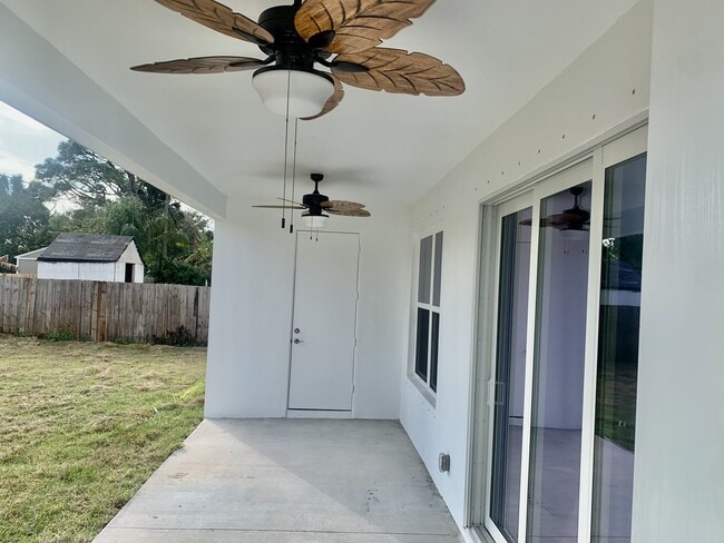 Building Photo - "Spacious 4-Bedroom Oasis with Granite Touches & Cozy Fireplace in Palm Bay!"