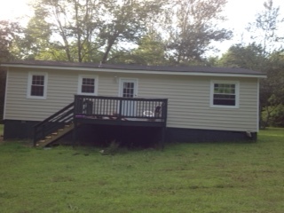 This is a rear shot of the house, showing the rear deck. This is also being renovated and will be freshly stained when you move in. - 2680 Ballsville Road