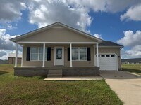 Building Photo - Newly Renovated 3BR 2BA home close to GM, Magna, Industrial Park