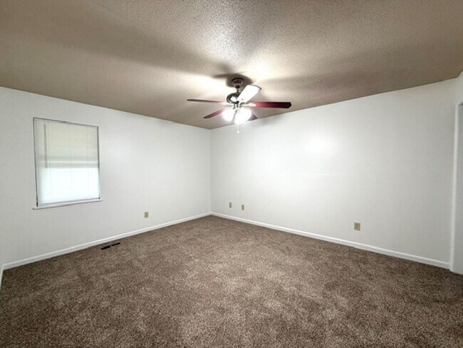 Building Photo - 2 Bedroom 1 Bath Duplex with garage/basement, side porch, and carport.