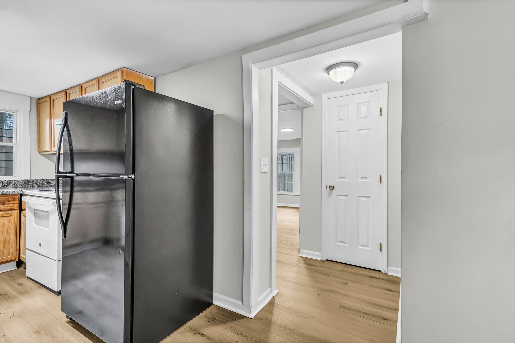 From kitchen, find a full bathroom, the first bedroom, and a storage closet - 844 E 37th St