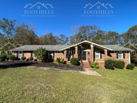 Building Photo - Quaint 3-Bedroom Brick Ranch with Custom T...