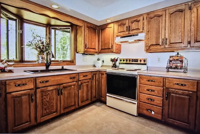 Wood cabinets and natural light kitchenkitchen - 808 Pony Ln