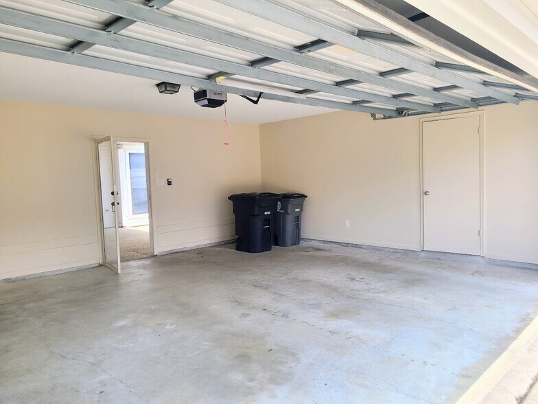 Enclosed 2-Car Garage off of patio with storage room - 12439 Coursey Blvd