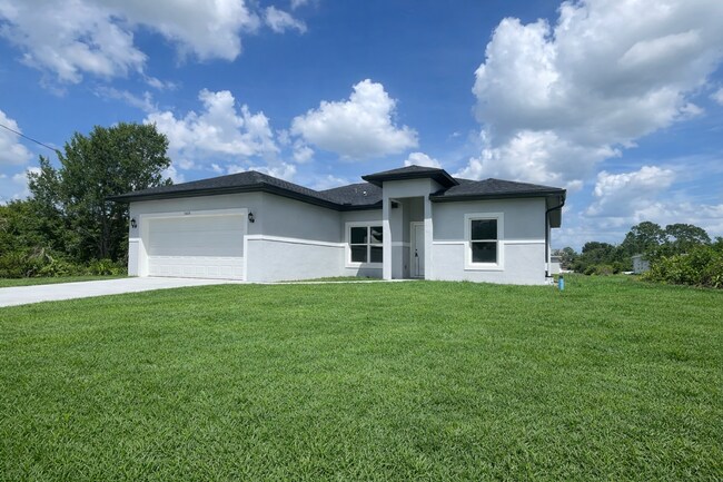 Building Photo - Brand-New & Modern! 4/2/2 Home in Desirable SW Lehigh Acres