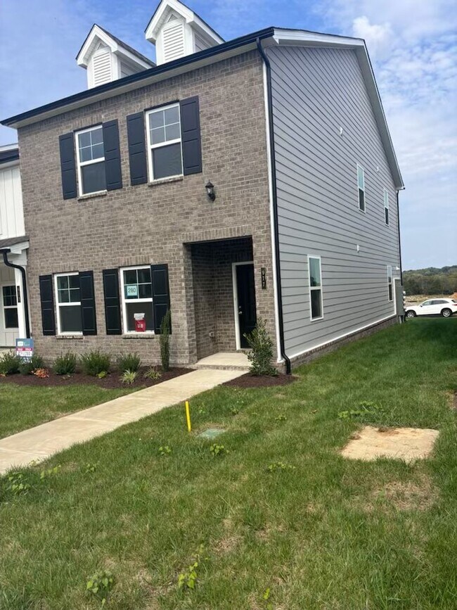 Building Photo - **BE THE LUCKY ONE TO LIVE IN THIS 2024-BUILT END-UNIT TOWNHOME IN A RESORT-STYLE COMMUNITY**