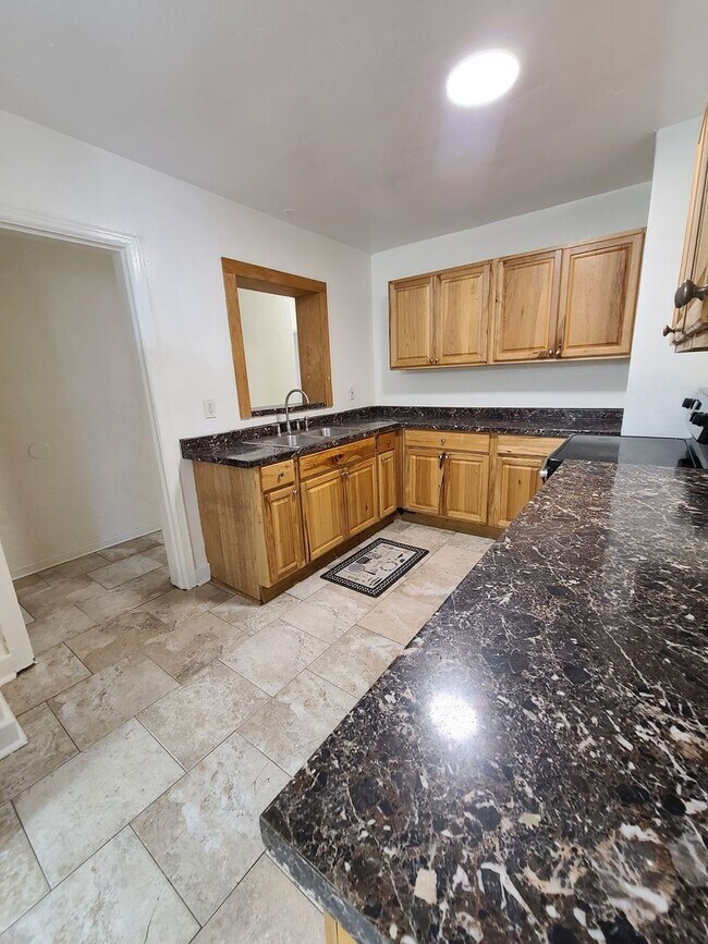 Building Photo - Stunning Corner-Lot Rental: 4BR/2BA with Courtyard