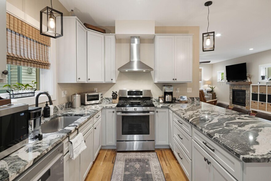 Open concept kitchen makes entertaining easy. You can cook while chatting with guests. - 33 Rex Dr